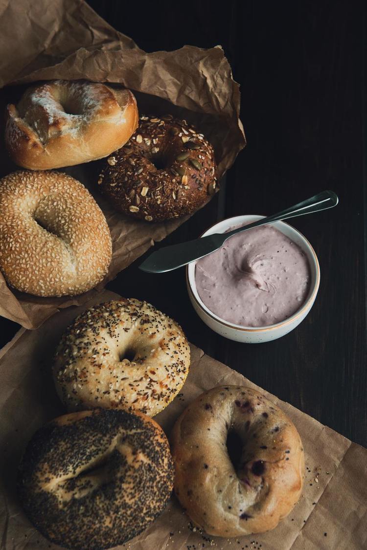 Assorted Poppy Seed and Sesame Bagels with Raspberry Cream Cheese