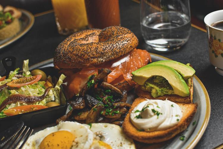 Smoked Salmon with Mushrooms, Avocados, Fried Eggs and Poppy Seed Bagels