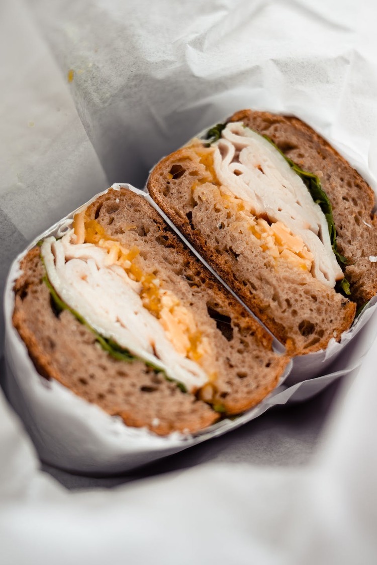 Whole Wheat Bagel Sandwich with Egg, Sliced Chicken and Lettuce