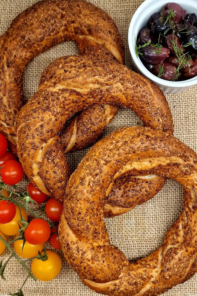 Turkish Sourdough Simit Bagels with Olives, Cherry Tomatoes and Sesame Seeds Recipe
